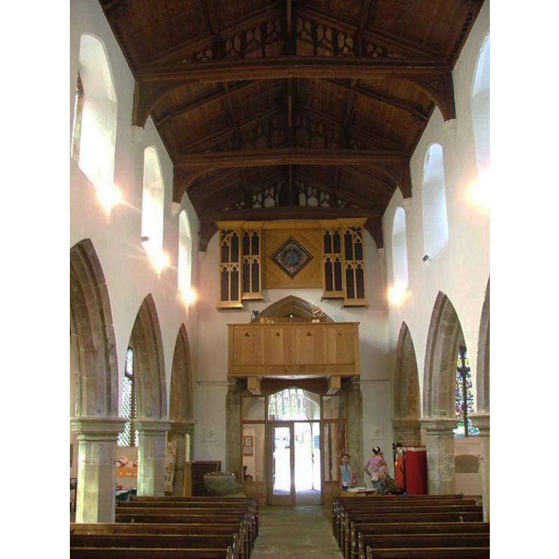 the font at the west end, to the south side of the west doorway