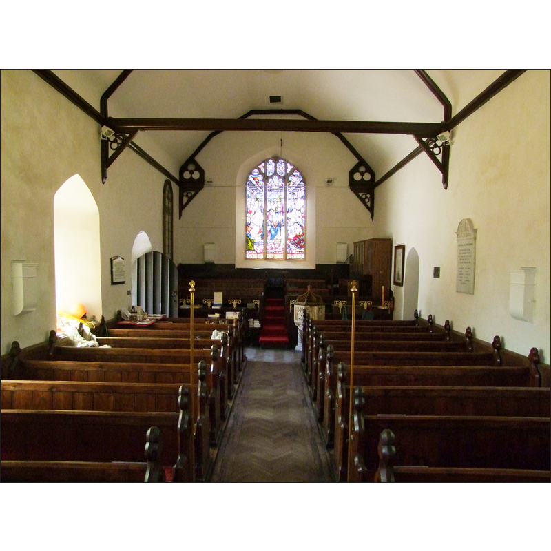 the font and cover are visible at the back (west), behing the bank of pews on the right (north) side