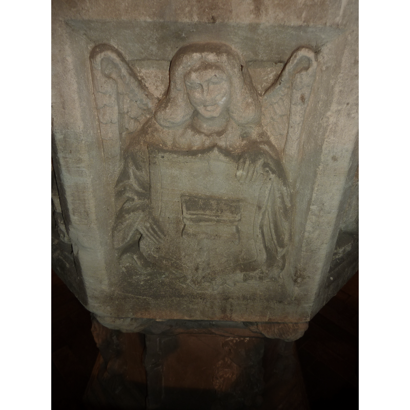 one of four such angels, alternating with the symbols of the Evangelists on the sides of the basin; this is on the west side