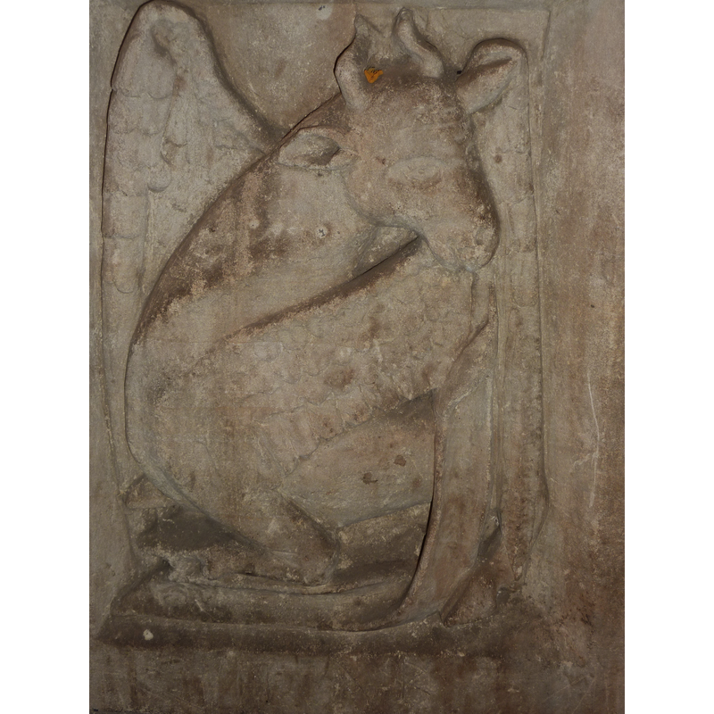 one of four such symbols, alternating with angels holding shields on the sides of the basin; this is on the southwest side