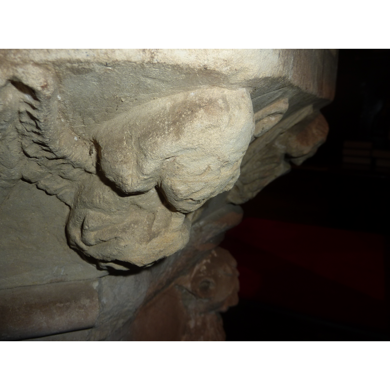 or holding an unidentified object; the cherubs are damaged and the identification is tentative