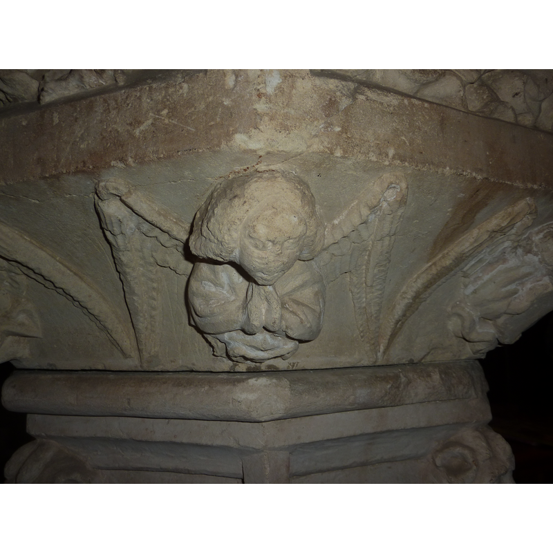 or holding an unidentified object; the cherubs are damaged and the identification is tentative
