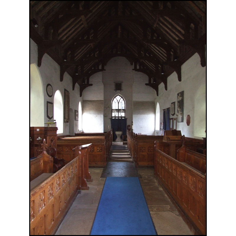 the font and cover at the back (west) of the nave, just east of the tower entrance
