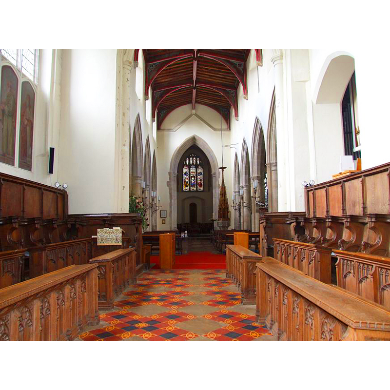 the font and cover are visible at the west end of the nave, by the north side of the tower arch