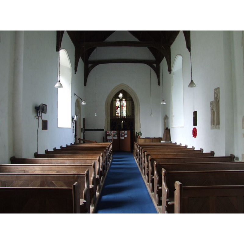 the font and cover are partially visible in a niche at the back (west) of the nave, on the right (north) side