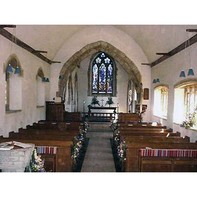 the upper part of the font partially visible in the foreground, left (north) side