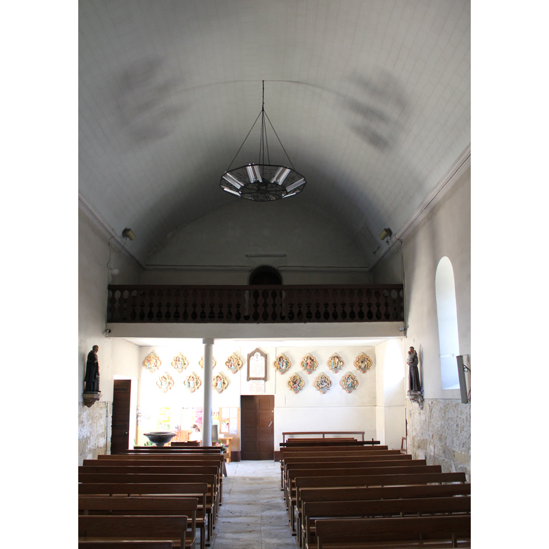 the south side of the chancel; the modern font visible in the lower corner