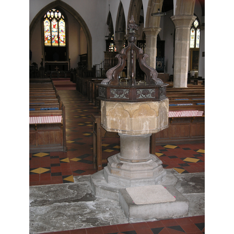 the font seen from beneath the tower, looking east towards the altar