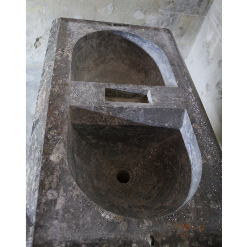 the baptismal well with a drain