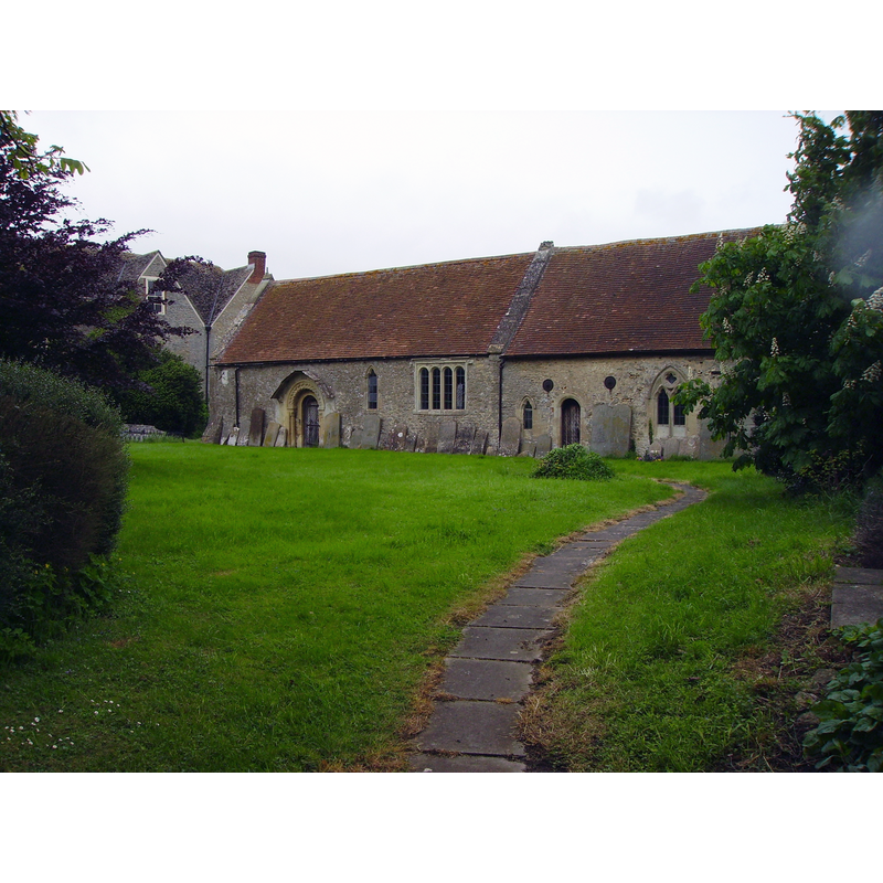the medieval chapel of St. George; in ruins for many years, it is now restored to religious use; on the left, the manor house