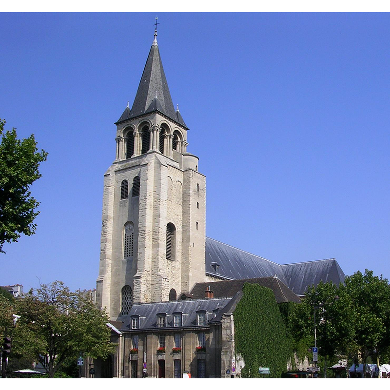 the dark roof the medieval church can be seen behind the front building