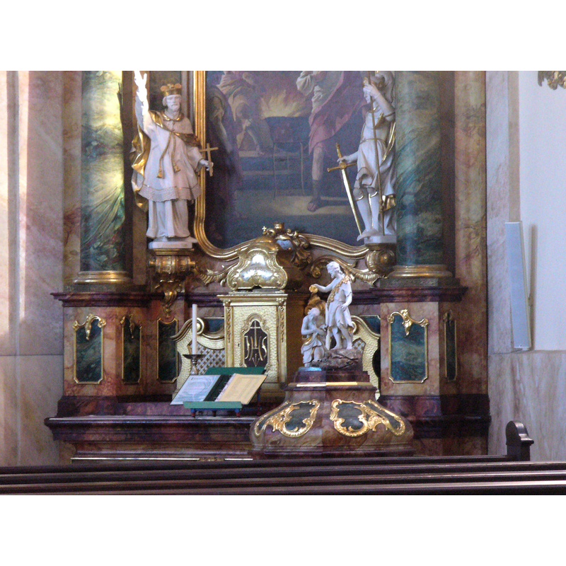 the 18th-century (?) font cover visible behind the railings
