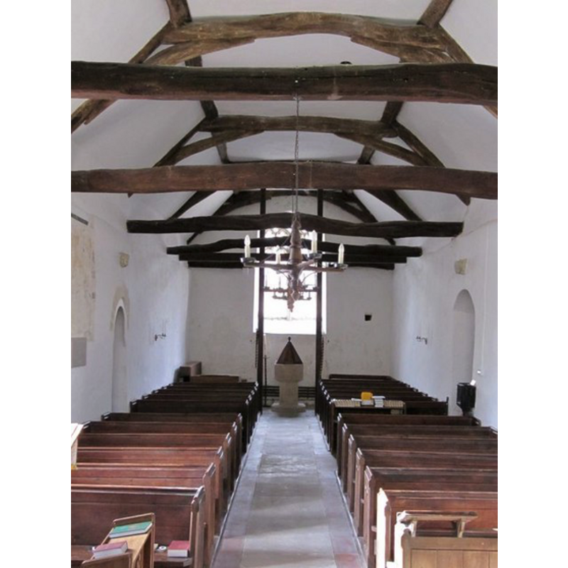 the present font and cover at the west end of the nave