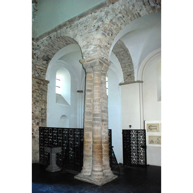 the old font is located behind the railing; the font is front is modern