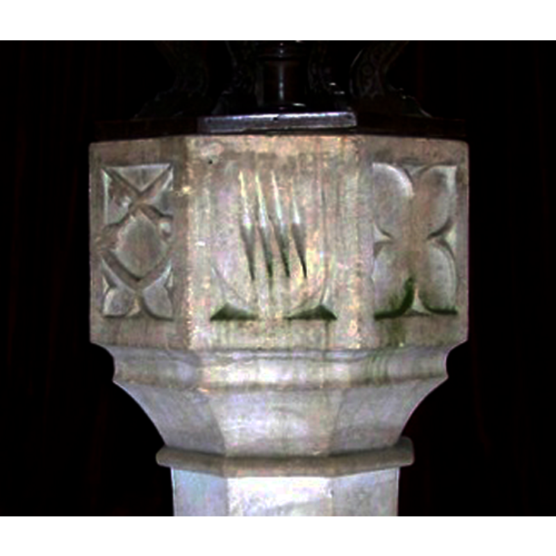 the shield sides are the sides of the panel; the cusped quatrefoil below is trimmed by the pointed bottom of the shield