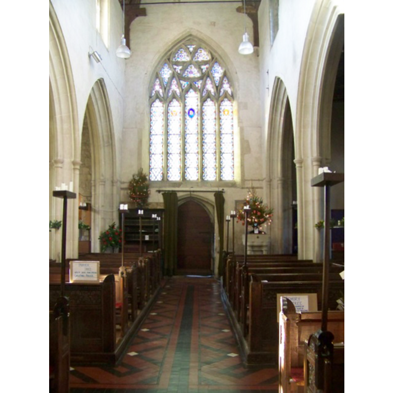 the upper half of the font is visible at the far (west) end, right (north) side of the nave