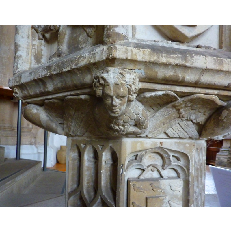 at four of the angles of the underbowl, alternating with winged hearts