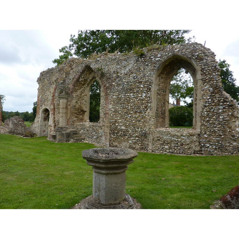 the later font remains in the context of what appears to be the western side of the nave; the remaing wall with the two large windows would be the south wall
