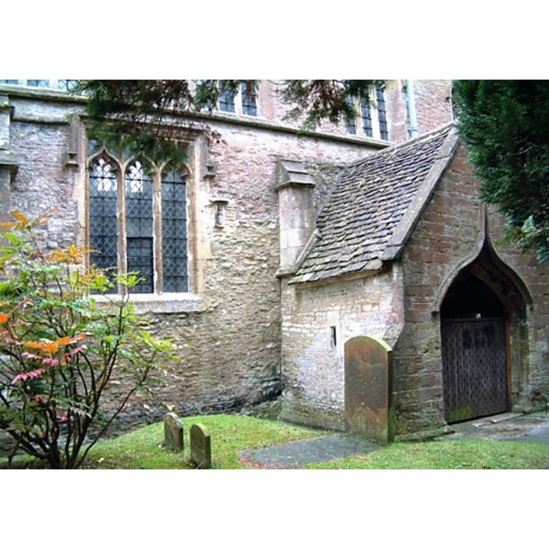 the Sheela is visible on the exterior south wall of the church, to the right of the window, left of the south porch