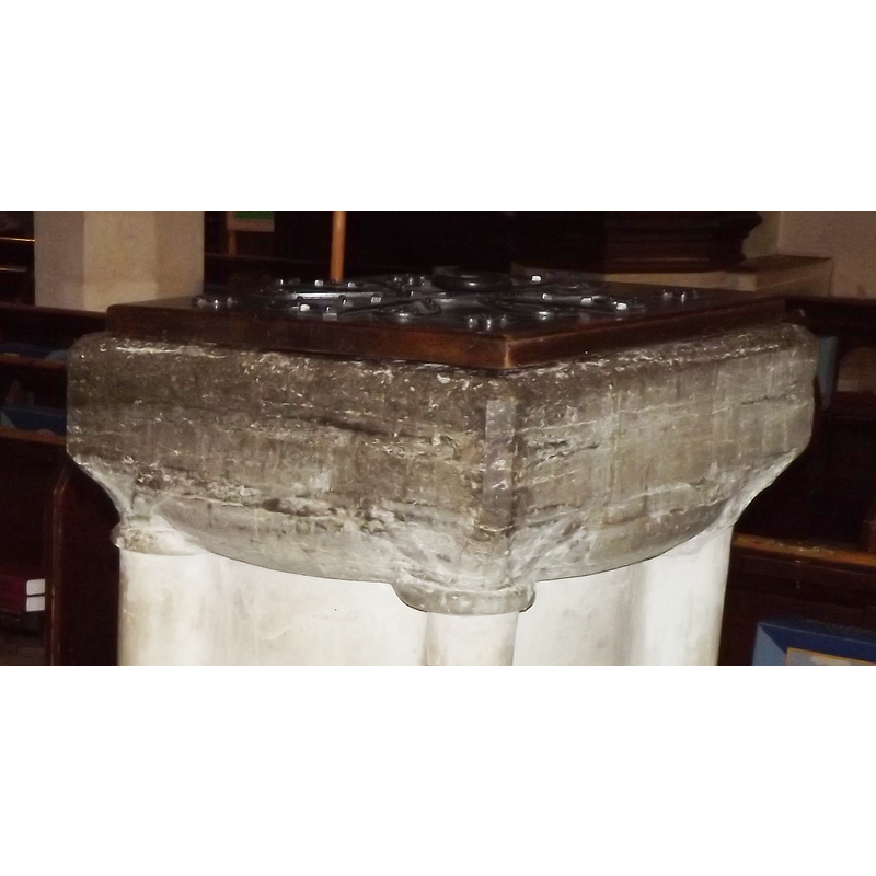 carved on each of the angles of the underbowl, and serving as capital to the outed colonnettes of the base [the whole base is a modern replacement]