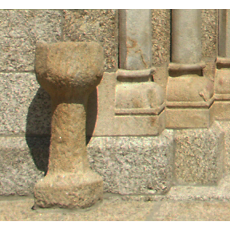 the stoup on the left side of the entranceway