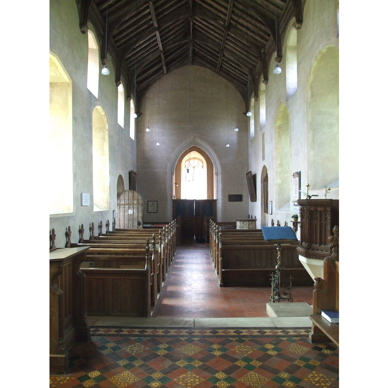the top of the font is visible on the (right) north side, opposite the open south door