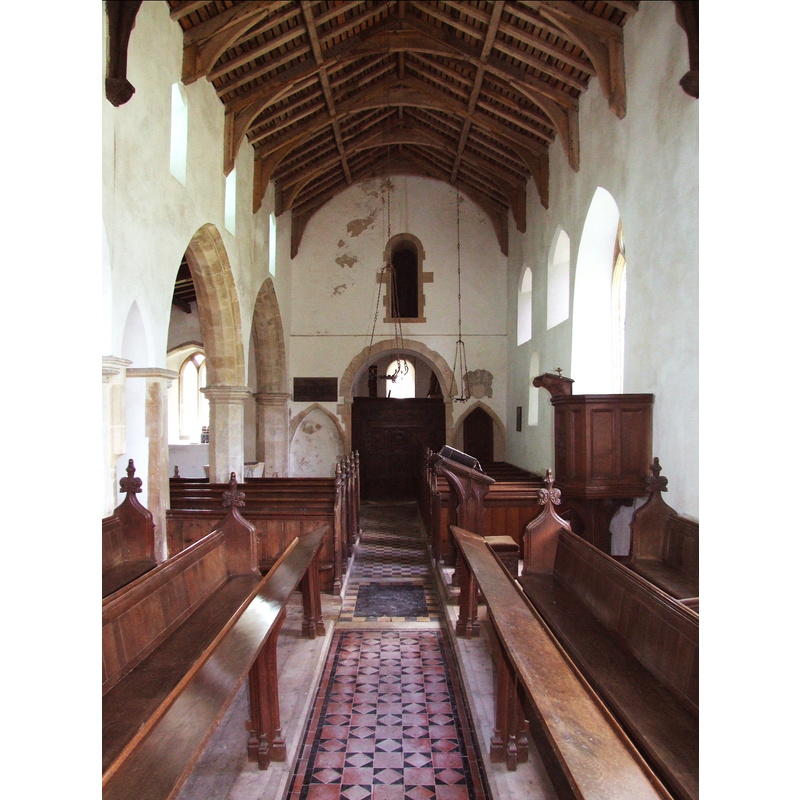 the top of the font is visible in the westernmost bay of the south arcade