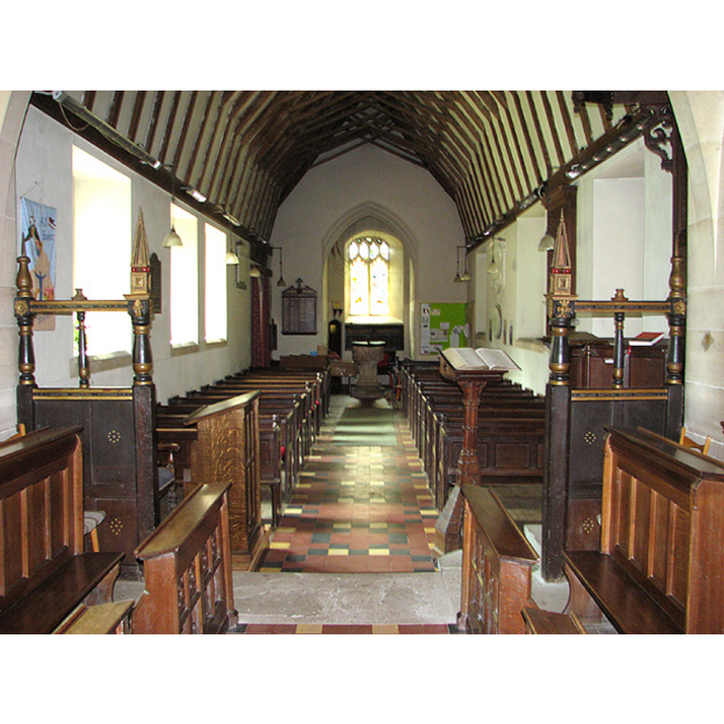 the font visible at the west end of the nave
