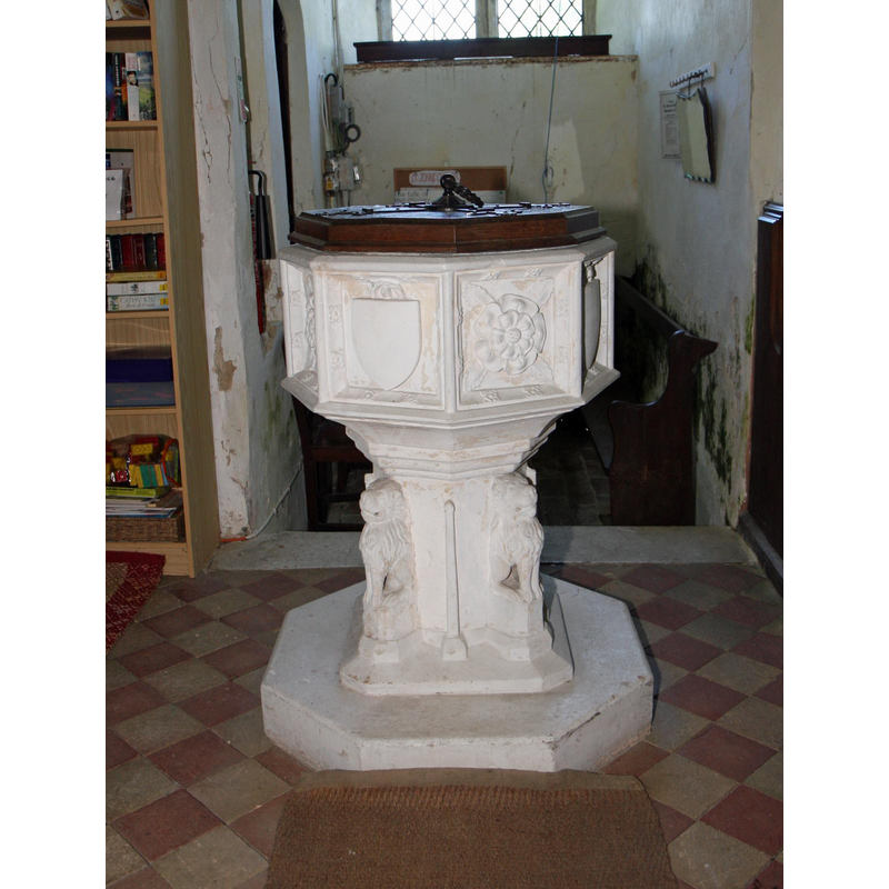 behind the font is the narrow space of the west tower