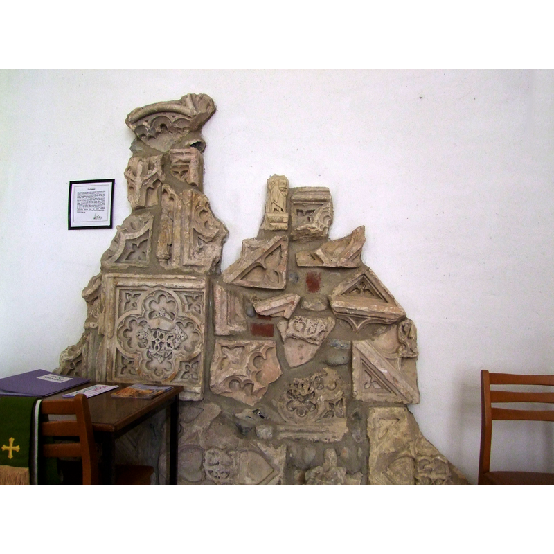 the puuzle-like arrangement using old fragments; it may include parts of the old plinth [cf. FontNotes]