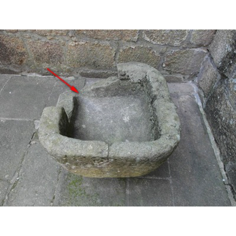 the site of the side drain indicated by the red arrow