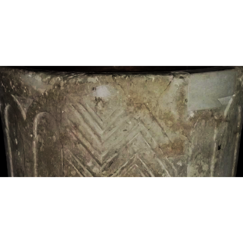 notice the damage and repairs to the upper part of the basin; this is the east side of the font at present
