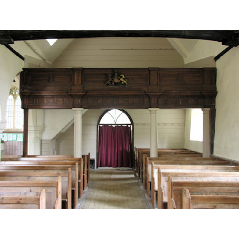 the side of the font is discernible in the south aisle, left (south) side, at the far (west) end