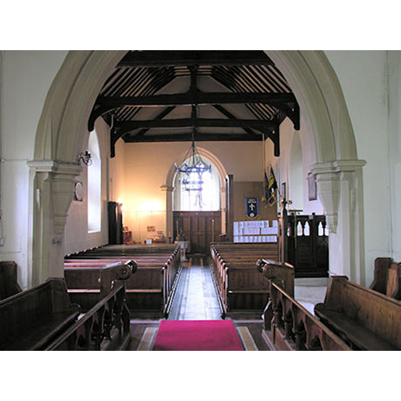 the modern font and cover are visible at the back (west), to the left (south) of the centre aisle