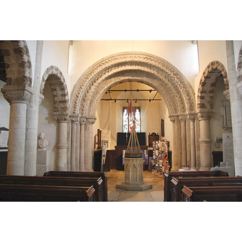 the font in the context of the tower arch and the west end of the nave