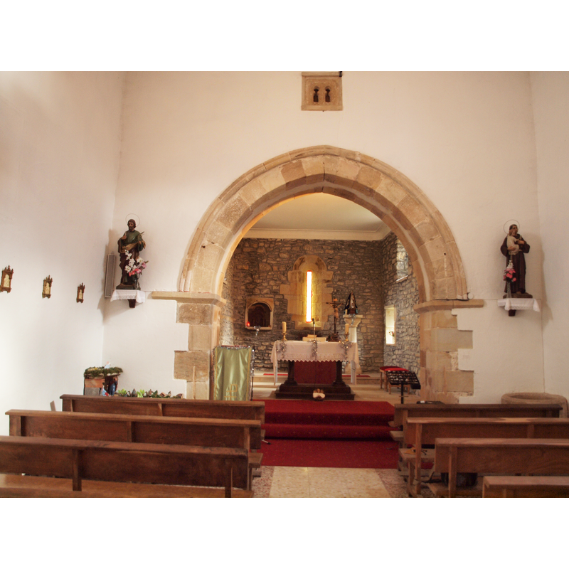 the top of the font is visible at the right-hand corner of the chancel arch (not its original liocation) -- notice the small window above the chancel arch, probably a survival of the Mozarabic church here