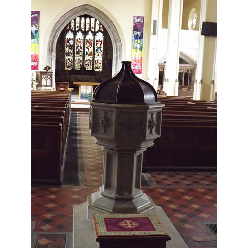 the modern font and cover in the context of the nave; looking east