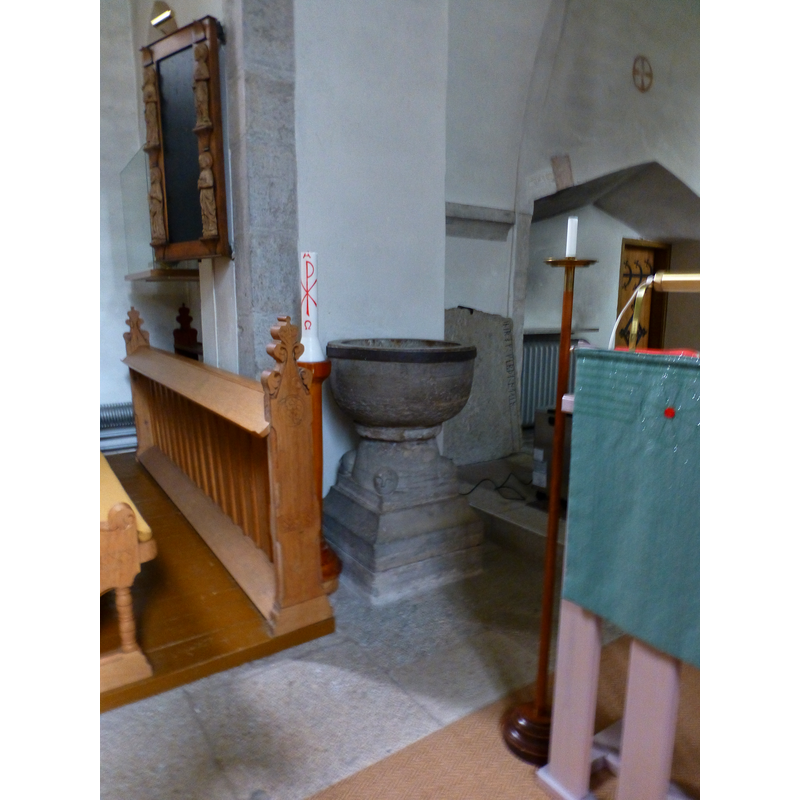 against the north side of the chancel arch