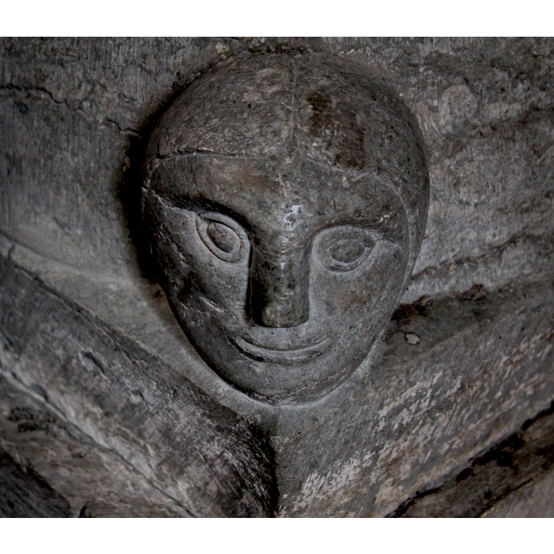 on the southwest coner of the lowert base; it appears to be wearing a hood