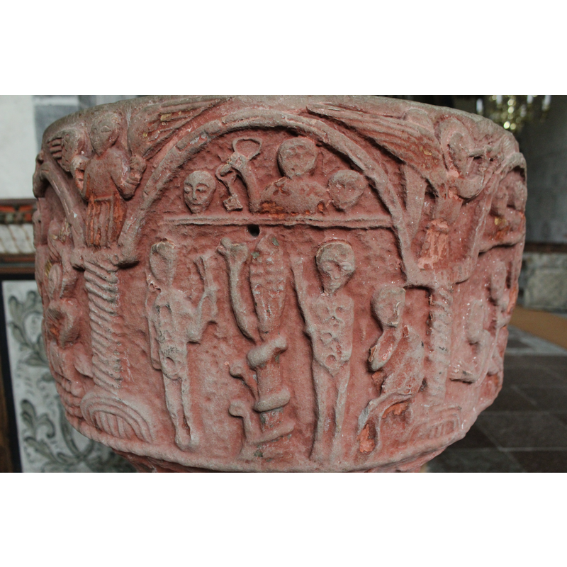 The lower part of this composition shows God enthroned, is haloed with a cross. His hands are stretched toward the left pulling out Eve. Adam lies sleeping diagonally, facing left with arms bent at the elbows at 90* angle. Above the scene is a horizontal ledge, on which three figures appear (angels). In the spandrel to the left, an angel in profile, haloed blows a trumpet. Spandrel to the right, two figures, face to face, embrace and they have very long braids. The Visitation scene in the spandrel. This program moves from the right to the left.