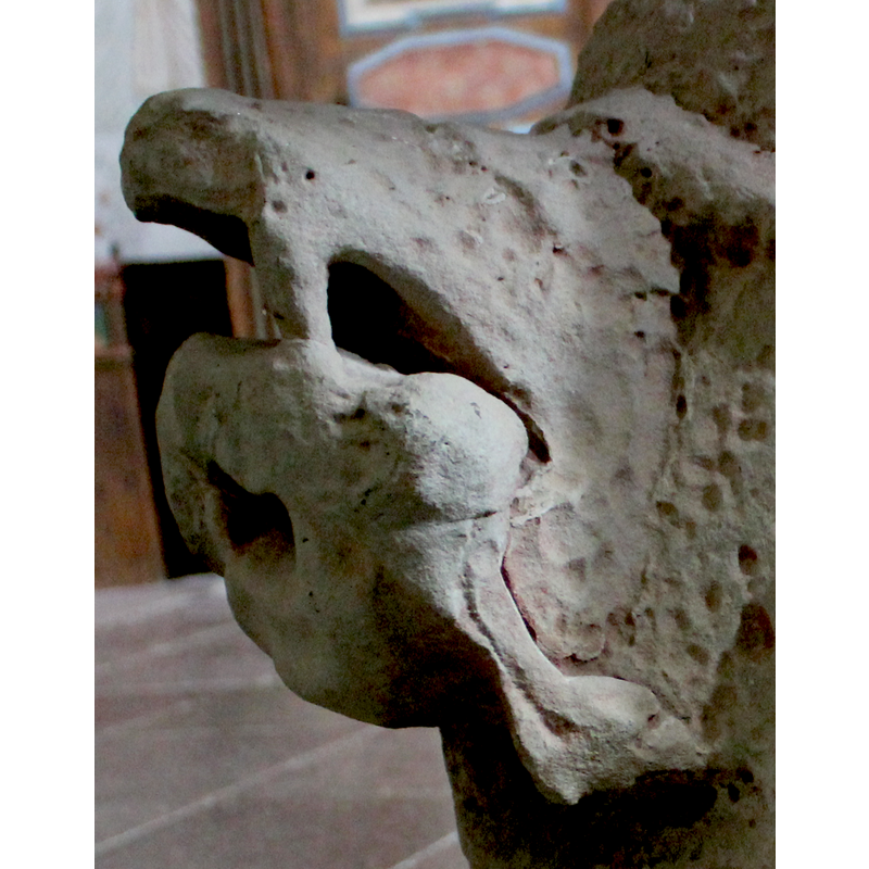 on the southwest side of the base -- orientation is approximate -- side view: the animal could be a bear; the prey appears animal as well; too eroded for identificantion