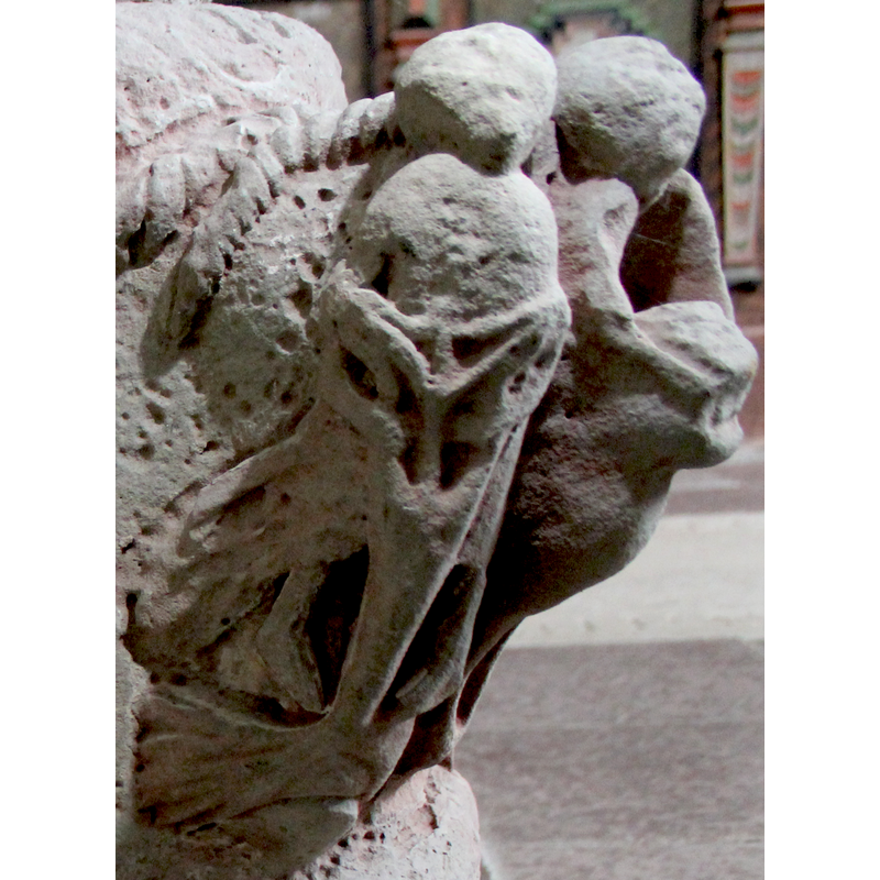 on the southeast side of the base -- orientation is approximate -- angle grouping: Samson with long hair fighting the lion. He is on the right with the lion and on his side is a woman who apeears to be devoured by a large fish - figure has long, long braid. Her robes fly backward - Delilah?