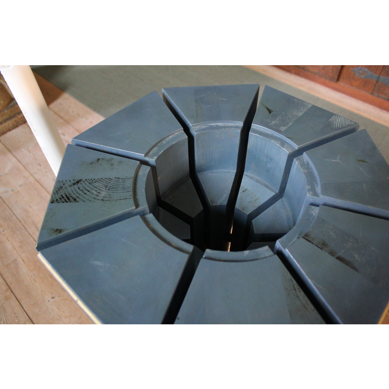 the modern font in use for baptisms; it is made of wood and accommodates a metal basin that holds the baptismal water