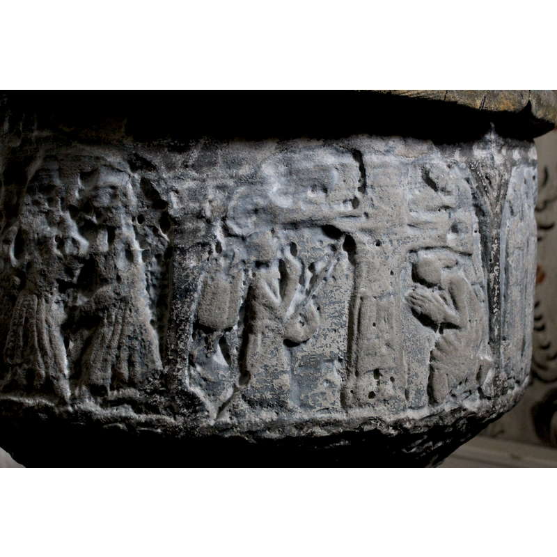 the figure to the left of the cross carries a spear; two figures on the right; the one at the bottom right is kneeling, the hands together in prayer, long hair [is it Mary?] -- the figure in the upper-right corner is also in a prayer stance [John?]