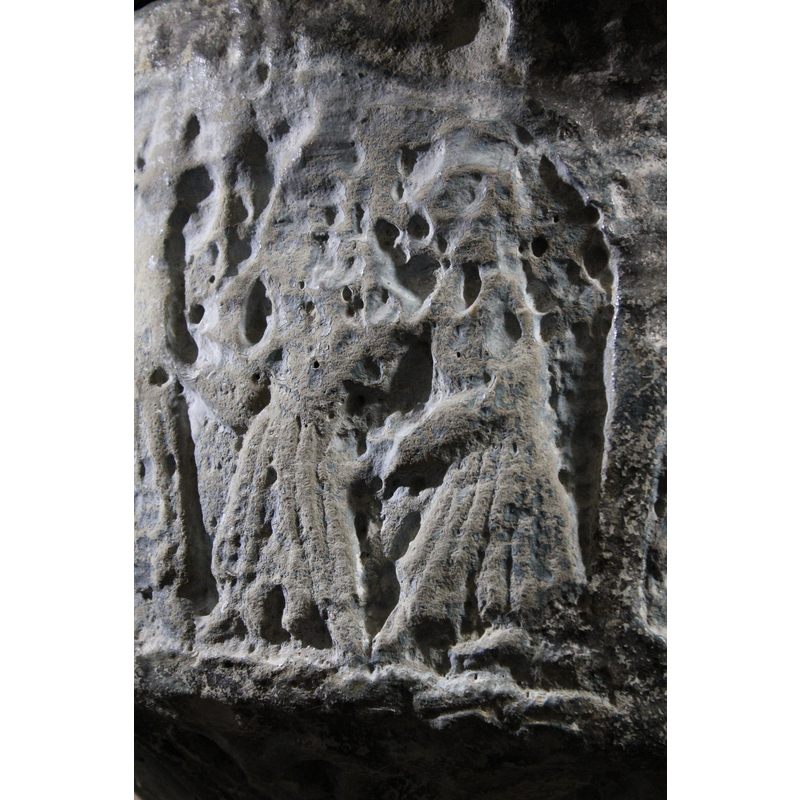 the two figures in the right corner of the scene; the soldiers casting lots for the division of Christ's clothes?