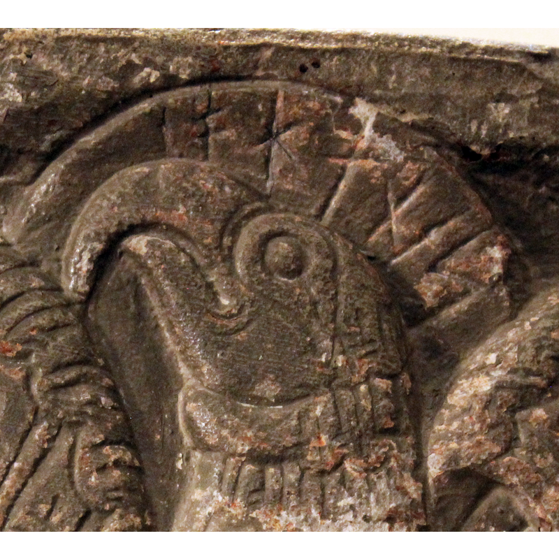 haloed head with Runic inscription identifying the figure as John's symbol