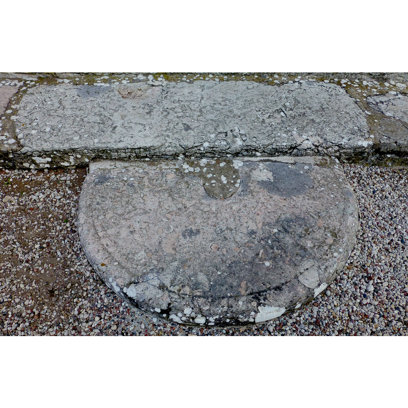 a recycled stone used now as step in the southwest entrance; is it a former font lower base or plinth?