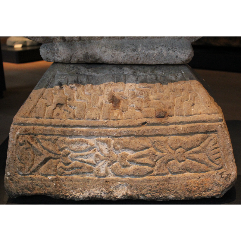 on the upper part of the base; side 1