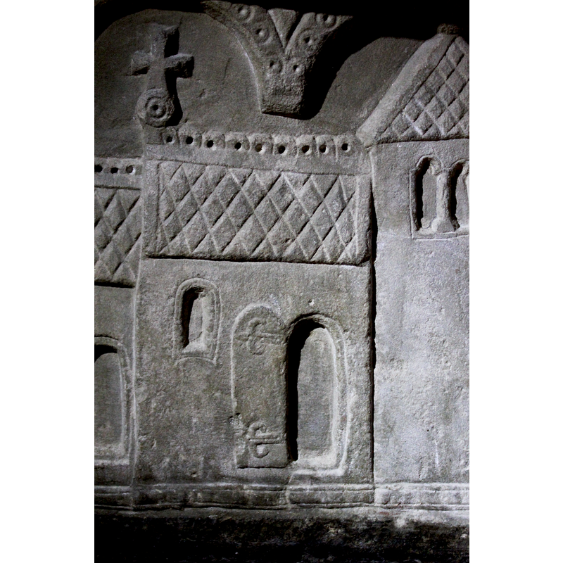 the volume corresponding to the nave; notice the simulated iron-work on the door, a design quite common on the door hardware of Gotland churches; the door would open into the west end of the nave, inside of which the baptismal font was often located. The mullioned window opening high in the tower wall, with two round arch-heads