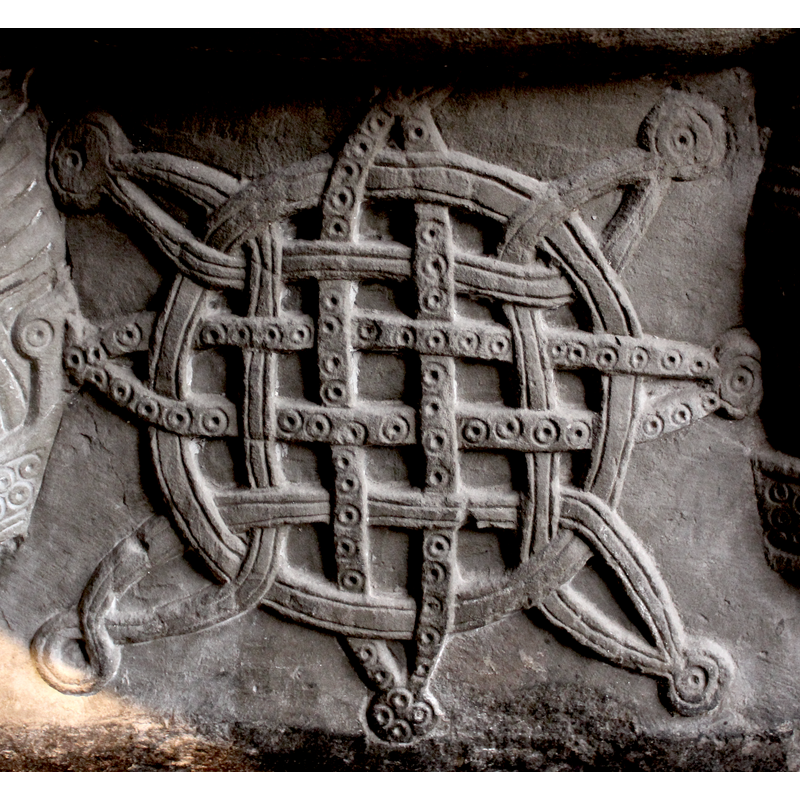 some [not all] of the elements have beaded-tape pattern on them; the eight endings have dot-in-a-circle motifs
